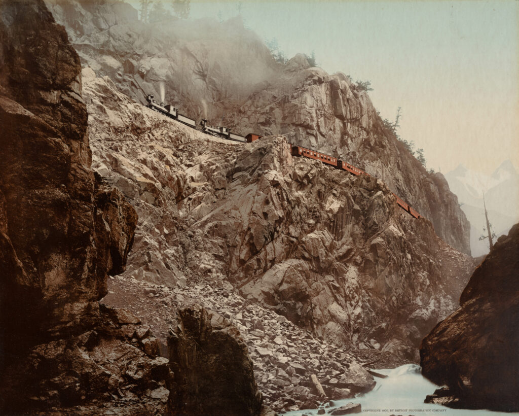 Image of Train Going across the side of a mountain