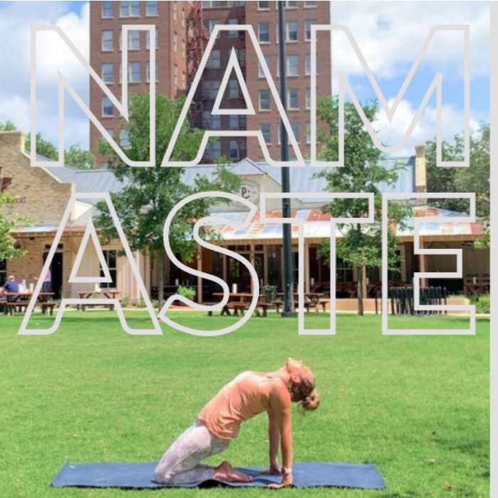 Women Doing Yoga In Park With Graphic Saying Namaste